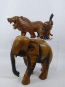 A Miscellaneous Collection of Carved Wooden Animals, including a lion approx 42 cms long, an