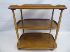 An Ercol Oak Tea Trolley, two shelves on castors, approx 73 x 45 x 74 cms