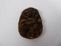 A Chinese Hard stone Pendant, depicting a dragon, approx 5 x 4 cms