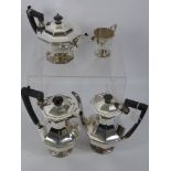 An Art Deco Style Four Piece Tea and Coffee Set. The set including tea pot, coffee pot, water pot