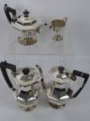 An Art Deco Style Four Piece Tea and Coffee Set. The set including tea pot, coffee pot, water pot