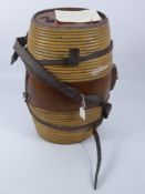 A Vintage Agricultural Workers Oak and Cane Barrel Harness, the cylindrical barrel tapers with a