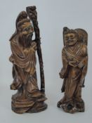 Chinese Wood Carved Figures, the male approx 38 cms high, the female approx 30 cms high.