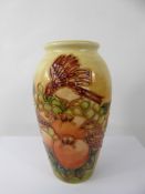 A Moorcroft Vase 'Finches Ochre' design, approx 19 cms, factory marks to base.