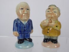 A Pair of Porcelain Salt and Pepper Pots, one in the form of Edward Heath, the other Harold