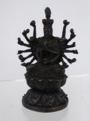 A Bronze Figure of a Multi-Armed Buddhist Deity, seated on a lotus base, approx 11 cms high.