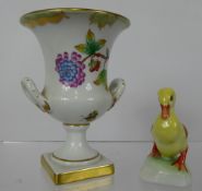 A Herend Urn Vase, hand painted with floral spray together with a Herend duckling. (2)