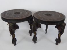 A Pair of South Asian Carved Occasional Tables, the tables having three legs carved wtih