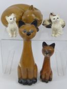 A Miscellaneous Collection of Cats, two composite, one approx 29 cms high, the other sleeping, two