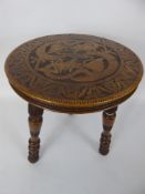 An Antique Welsh Spinning Stool, the stool having finely carved top depicting chasing dragons with