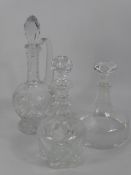 A Trio of Cut Glass Decanters and Stoppers.