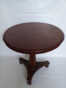 A Victorian Circular Mahogany Tilt Top Table, approx 88 x 75 cms.
