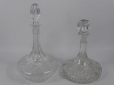 A Pair of Cut Glass Ship's Decanters and Stoppers, one approx 38 cms high, the other approx 30 cms