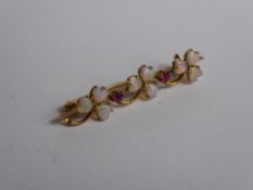 A Lady's 9 ct Gold Opal and Ruby Brooch, 2 x 2.15 ruby, 3.5 mm opals .approx 2 gms,