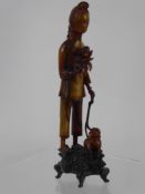 A Chinese Carved Horn Figure of a Girl with a Monkey, approx 24 cms high.