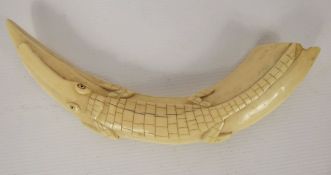 A Late 19th Century Congolese Ivory Tusk, carved crocodile to the top, approx 27 cms.