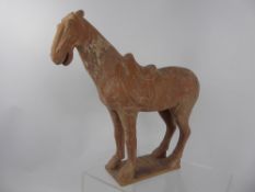 A Chinese Antique Ceramic Figure of a Horse, possibly Tang. The horses's tail is missing, approx