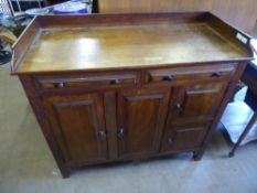 An Antique Oak Sideboard, with two long cupboards, two short cupboards and two drawers above,