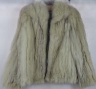 A Lady's White 3/4 Fur Jacket by SAGA, Size 12.