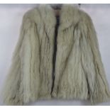 A Lady's White 3/4 Fur Jacket by SAGA, Size 12.