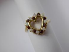 A Lady's 9 ct Yellow Gold Garnet and Opal Ring, the ring heart shaped, 8 x 2 mm opals, 8 x 2 mm