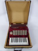 A Vintage WorldMaster Piano Accordian, in good condition, in hard case.