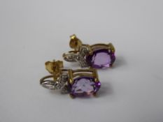 A Pair of Lady's 9 ct Gold Amethyst and Diamond Earrings, amethyst 9 x 7 mm, approx 5 pts of 8 cut