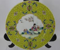 A Pair of 20th Century Chinese Plates, the plates depicting characters in a garden, approx 25 cms