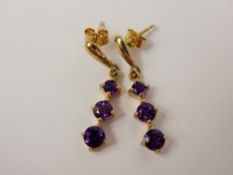 A Pair of Lady's 9ct Gold and Amethyst Three Stone Earrings, amethysts 3.5 mm - 4.5 mm, approx 2.3