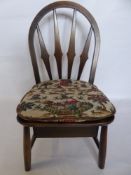 An Ercol Nursery Chair, with a single drawer beneath.