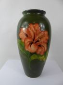 A Moorcroft Vase 'Hibuscus' design, approx 26 cms, factory marks to base.