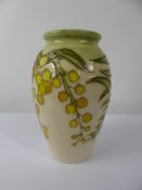 A Small Moorcroft Vase 'Australian Wattle' design, approx 11 cms, factory marks to base.