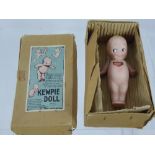 A Vintage KEWPIE Porcelain Doll, in original box.