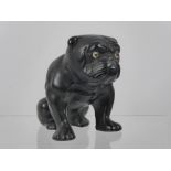 A Vintage Black Ceramic Bulldog, having glass eyes, approx 13 cms high (wf).