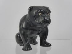 A Vintage Black Ceramic Bulldog, having glass eyes, approx 13 cms high (wf).