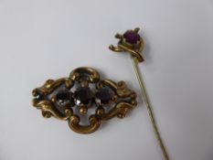 A Victorian 9 ct Gold Tested, Three Stone Garnet Brooch, garnet 1 x 8.6 mm, 2 X 7 x 6 mm, together