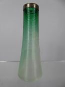 A Green Glass Match Strike, with silver top, approx 13 cms high.