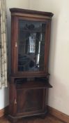 A Cottage Style Mahogany Glazed-Fronted Corner Cabinet, the cabinet having three shelves with pull-