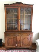 An Edwardian Mahogany Secretaire Bookcase, the bookcase with glazed fronted doors, two drawers and