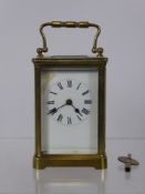 A Brass Case French Carriage Clock, white enamel face, Roman dial, approx 15 cms (af)