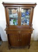 An Edwardian Mahogany Display Cabinet, two cupboards beneath, double glazed doors with shelved