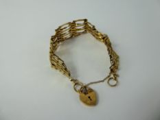 A 9 ct Gold Gate Link Bracelet, with heart from clasp, approx 7 gms