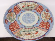 A 19th Century Chinese Famille Verte Charger. The charger depicting cranes and dragons with