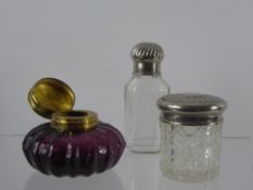 An Amethyst Glass Inkwell with Brass Lid, a glass container and glass perfume bottle. (3)