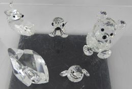 A Collection of Swarovski Animals, including a teddy bear, a swan, a deer, a seal and a penguin. (