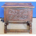 An Antique Wood-Carved Bible Box, raised on four turned legs and straight stretchers.