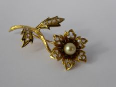 An 18 K Yellow Gold Diamond, Pearl and Enamel Flower Brooch, the brooch set with a pearl approx 6 mm