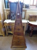 A Mahogany Triangular Chest of Drawers, the seven graduated drawers with smallest at the top and