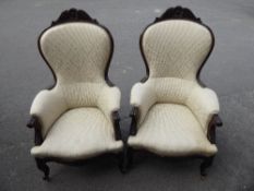 A Pair of Victorian Arm Chairs, with carving to arms and legs, serpentine fronted.