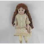 A German Catterfeld Puppenfabrik Bisque-Headed Doll, stitched leather body and legs, beautiful